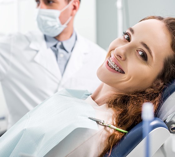 Woman visiting orthodontist for examination