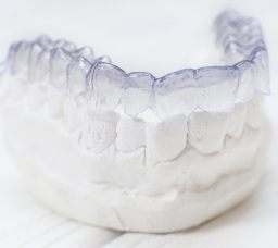 Clear aligner over lower dental mold