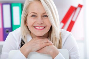 Close up of older woman with straight teeth